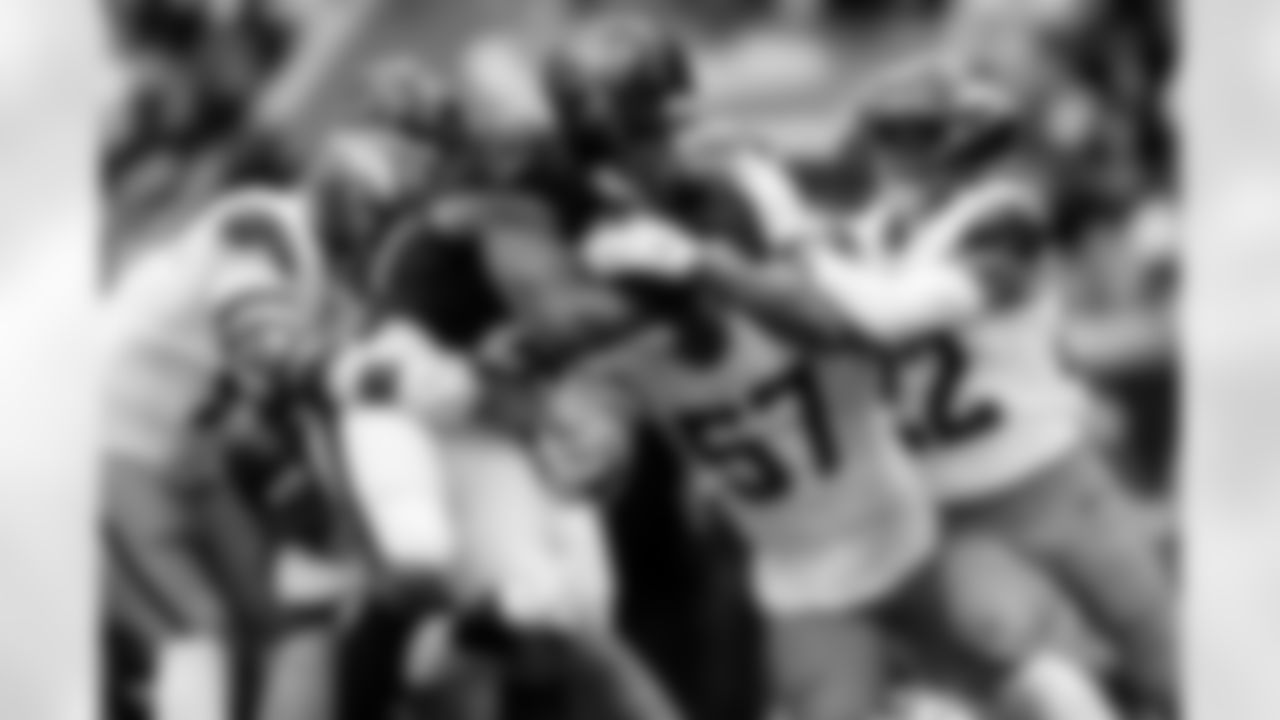 Denver Broncos linebacker Dre Greenlaw (57), defensive end Zach Allen (99) and safety Brandon Jones (22) tackle Houston Texans running back Nick Chubb (21) during the Broncos' Week 9 game against the Houston Texans at NRG Stadium in Houston, Texas on November 2, 2025. Photo by Ben Swanson / Denver Broncos