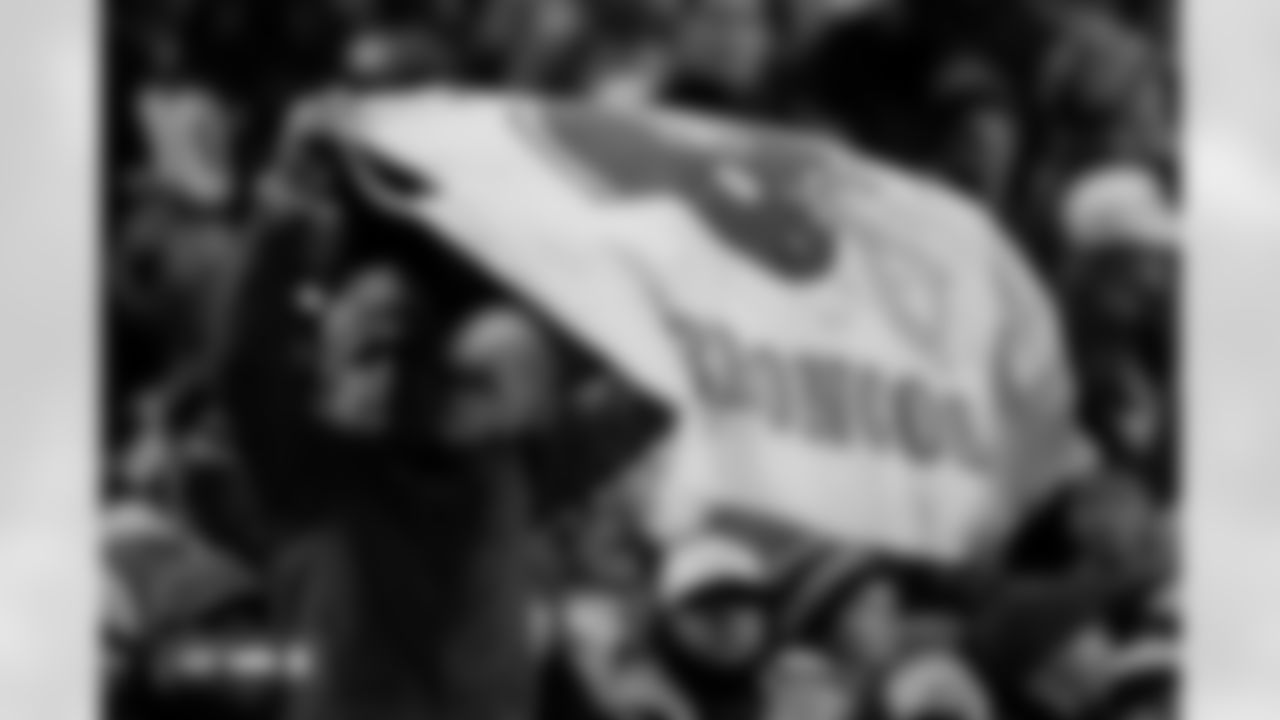 A fan holds up a throwback banner during the Broncos' Week 10 game against the Las Vegas Raiders at Empower Field at Mile High in Denver, Colorado on November 6, 2025. Photo by Ben Swanson / Denver Broncos