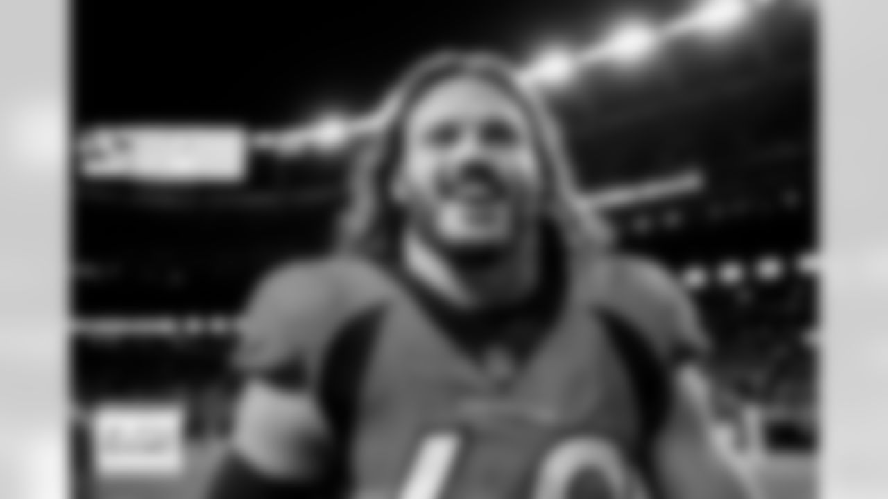 Denver Broncos linebacker Alex Singleton (49) smiles as he walks off the field after the Broncos' Week 17 game against the Los Angeles Chargers at Empower Field at Mile High in Denver, Colorado on December 31, 2023. Photo by Ben Swanson / Denver Broncos