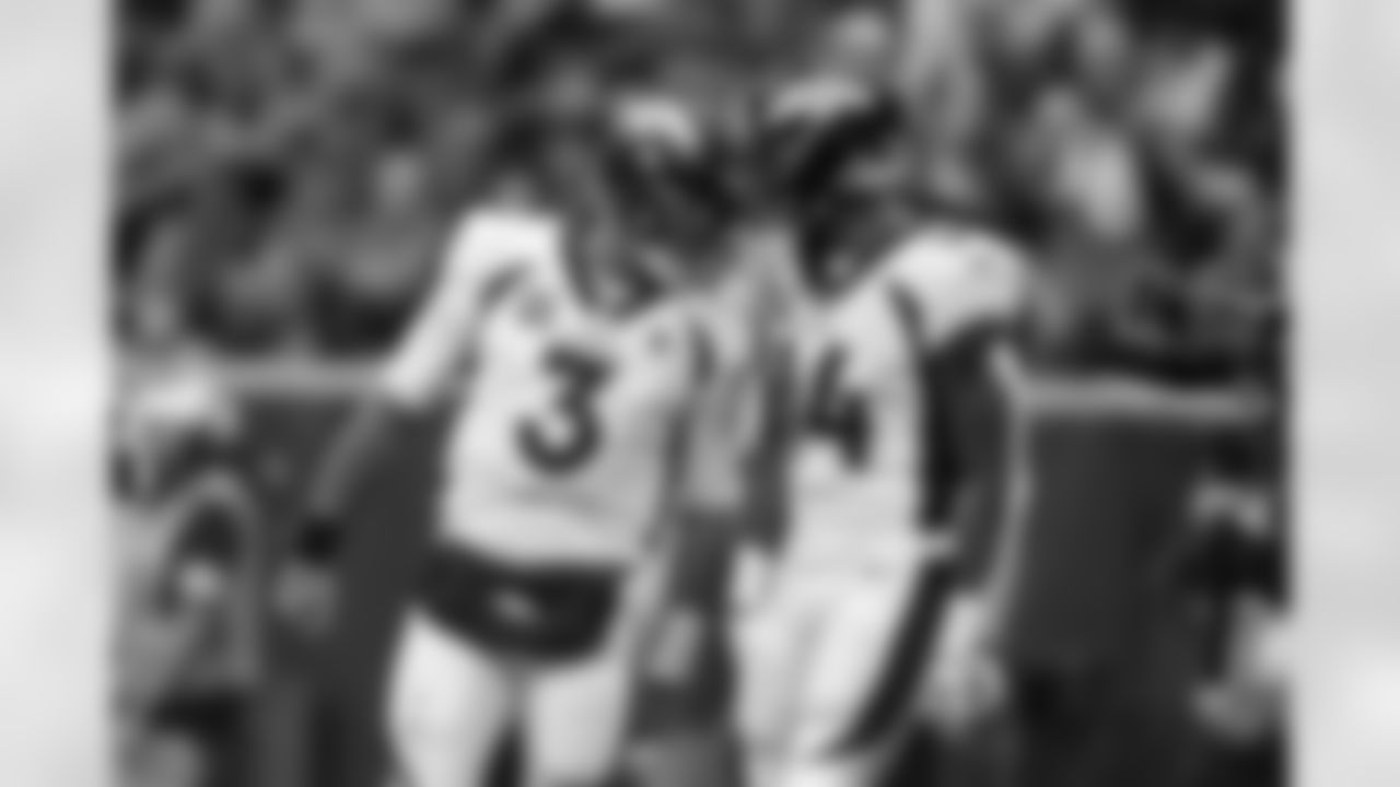Denver Broncos quarterback Russell Wilson (3) celebrates with wide receiver Courtland Sutton (14) after a touchdown reception during the Broncos' Week 13 game against the Houston Texans at NRG Stadium in Houston, Texas on December 3, 2023. Photo by Gabriel Christus / Denver Broncos