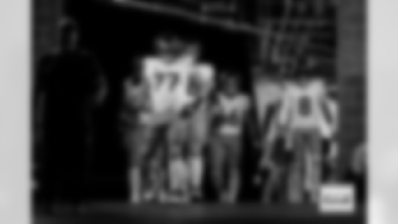 Denver Broncos guard Quinn Meinerz (77), fullback Adam Prentice (46), quarterback Jarrett Stidham (8) and others walk through the tunnel before the Broncos' Week 9 game against the Houston Texans at NRG Stadium in Houston, Texas on November 2, 2025. Photo by Gabriel Christus / Denver Broncos