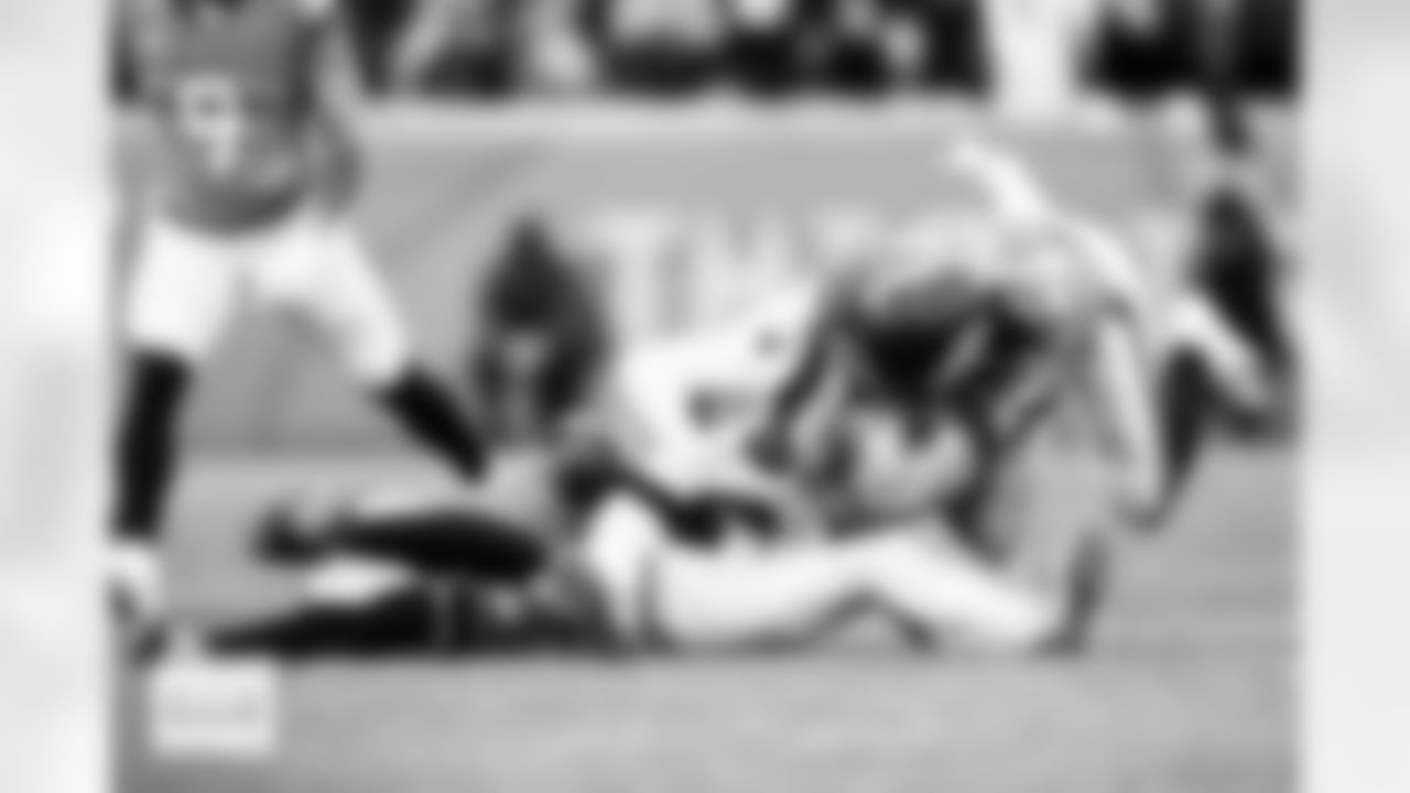 Denver Broncos cornerback Pat Surtain II (2) and linebacker Alex Singleton (49) tackles New England Patriots wide receiver Stefon Diggs (8) during the AFC Championship Game between the Denver Broncos and New England Patriots at Empower Field at Mile High in Denver, Colorado on January 25, 2026. Photo by Gavin Liddell / Denver Broncos