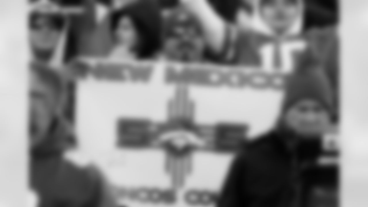 A fan with a "New Mexico" sign before the Broncos' Divisional Round playoff game against the Buffalo Bills at Empower Field at Mile High in Denver, Colorado on January 17, 2026. Photo by Gavin Liddell / Denver Broncos