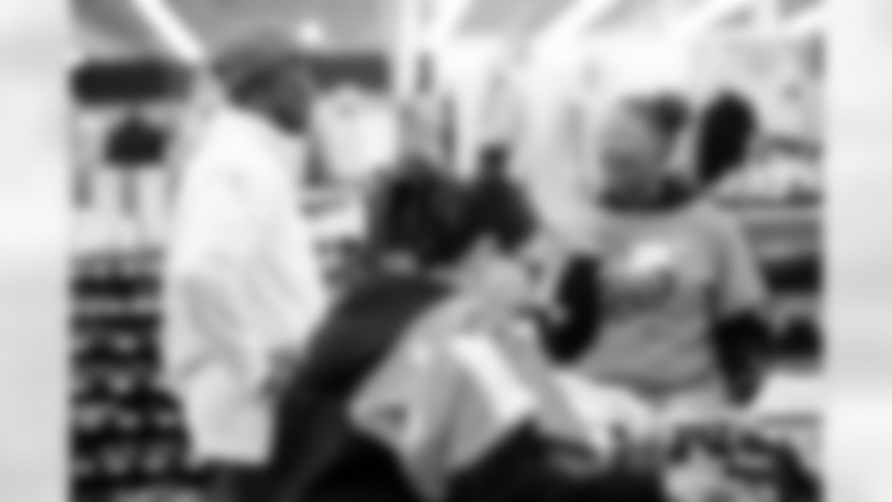 Children from the Boys & Girls Club participate in a Shop with a Jock shopping spree with Broncos players, alumni and cheerleader alumni in Aurora, Colorado on December 15, 2025. Photo by Ben Swanson / Denver Broncos