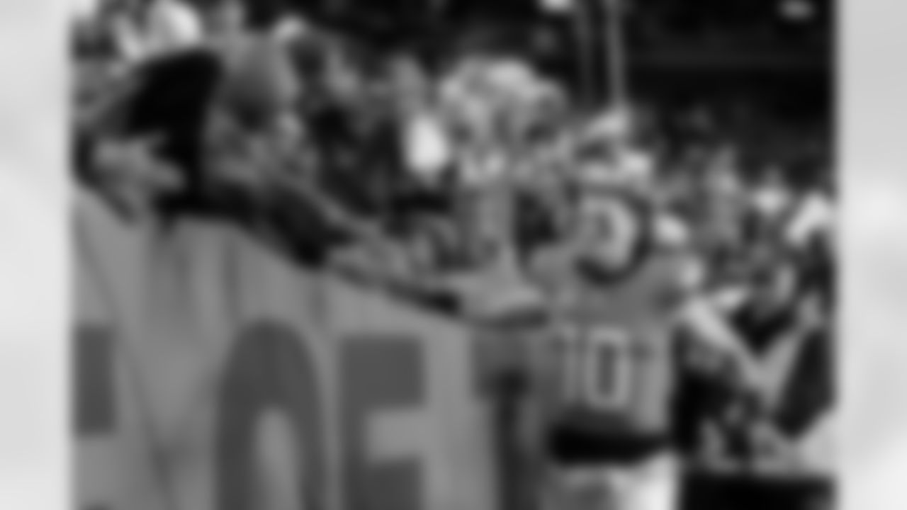 Denver Broncos quarterback Bo Nix (10) high-fives fans after the Broncos' Week 15 game against the Indianapolis Colts at Empower Field at Mile High in Denver, Colorado on December 15, 2024. Photo by Ben Swanson / Denver Broncos