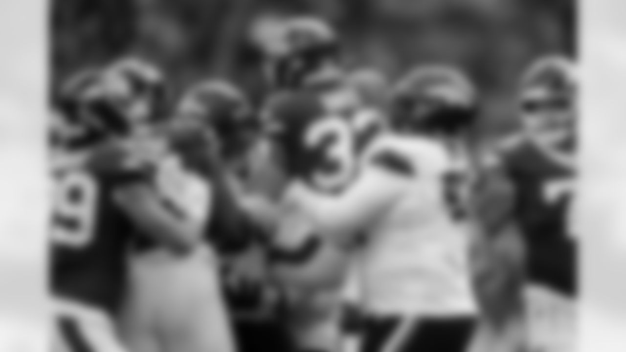 Denver Broncos defensive tackle D.J. Jones (93) and defensive end Zach Allen (99) puck up New York Jets running back Isaiah Davis (32) during the Broncos' Week 6 game against the New York Jets at Tottenham Hotspur Stadium in London, England on October 12, 2025. Photo by Ben Swanson / Denver Broncos