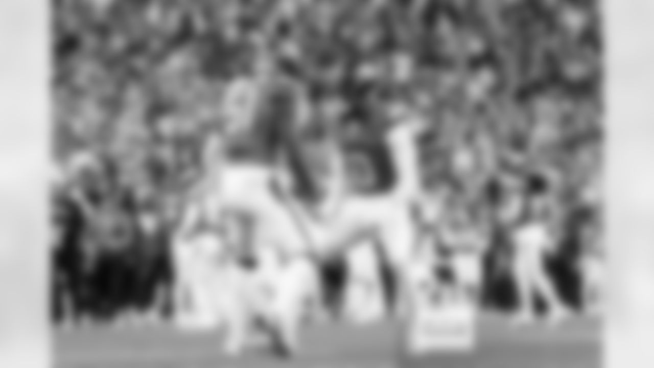 Denver Broncos linebacker Que Robinson (51) and linebacker Jonathon Cooper (0) celebrate during the Broncos' Week 11 game against the Kansas City Chiefs at Empower Field at Mile High in Denver, Colorado on November 16, 2025. Photo by Gavin Liddell / Denver Broncos