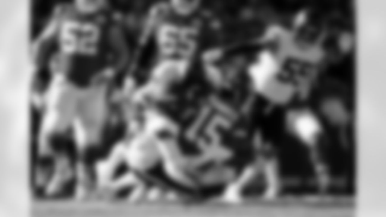 Nik Bonitto and Zach Allen hit Patrick Mahomes during the Broncos' Week 10 game against the Kansas City Chiefs at GEHA Field at Arrowhead Stadium in Kansas City, Missouri on November 10, 2024. Photo by Gabriel Christus / Denver Broncos