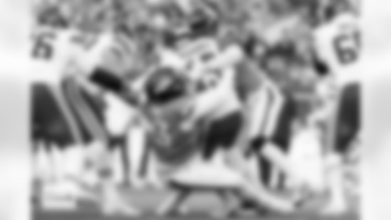 Denver Broncos defensive tackle D.J. Jones (93) and linebacker Que Robinson (51) sack Kansas City Chiefs quarterback Patrick Mahomes (15) during the Broncos' Week 11 game against the Kansas City Chiefs at Empower Field at Mile High in Denver, Colorado on November 16, 2025. Photo by Gabriel Christus / Denver Broncos