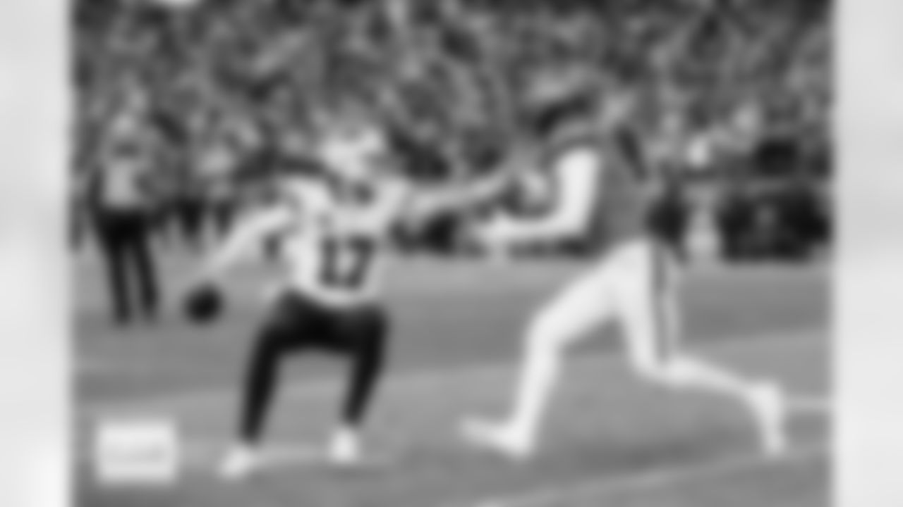 Buffalo Bills quarterback Josh Allen (17) scrambles and tries to stiff-arm Denver Broncos linebacker Jonathon Cooper (0) during the Broncos' Divisional Round playoff game against the Buffalo Bills at Empower Field at Mile High in Denver, Colorado on January 17, 2026. Photo by Ben Swanson / Denver Broncos