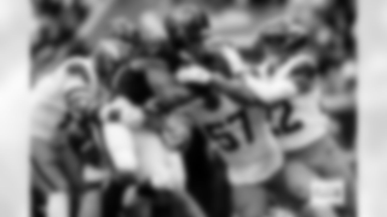 Denver Broncos linebacker Dre Greenlaw (57), defensive end Zach Allen (99) and safety Brandon Jones (22) tackle Houston Texans running back Nick Chubb (21) during the Broncos' Week 9 game against the Houston Texans at NRG Stadium in Houston, Texas on November 2, 2025. Photo by Ben Swanson / Denver Broncos