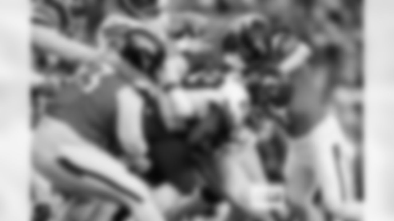 Denver Broncos defensive tackle Malcolm Roach (97) and defensive tackle D.J. Jones (93) tackle Kansas City Chiefs running back Kareem Hunt (29) during the Broncos' Week 11 game against the Kansas City Chiefs at Empower Field at Mile High in Denver, Colorado on November 16, 2025. Photo by Ben Swanson / Denver Broncos