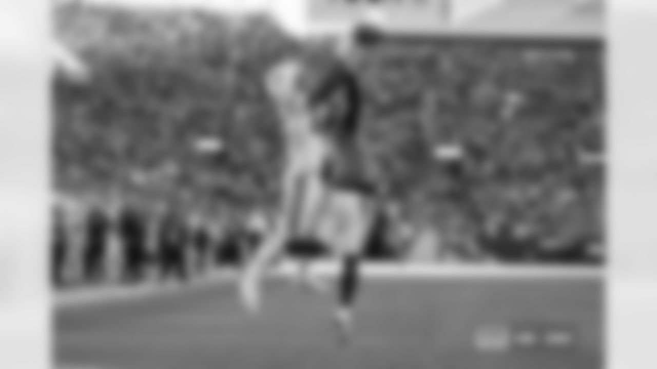 Riley Moss (21) breaks up a pass during the Broncos' Week 15 game against the Green Bay Packers at Empower Field at Mile High in Denver, Colorado on December 14, 2025. Photo by ADAM BRATTEN / Denver Broncos