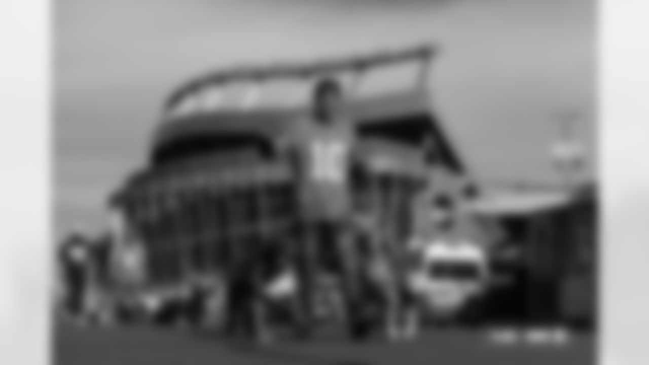 A fan walks his dogs before the Broncos' Week 18 game against the Los Angeles Chargers at Empower Field at Mile High in Denver, Colorado on January 4, 2026. Photo by Ben Swanson / Denver Broncos