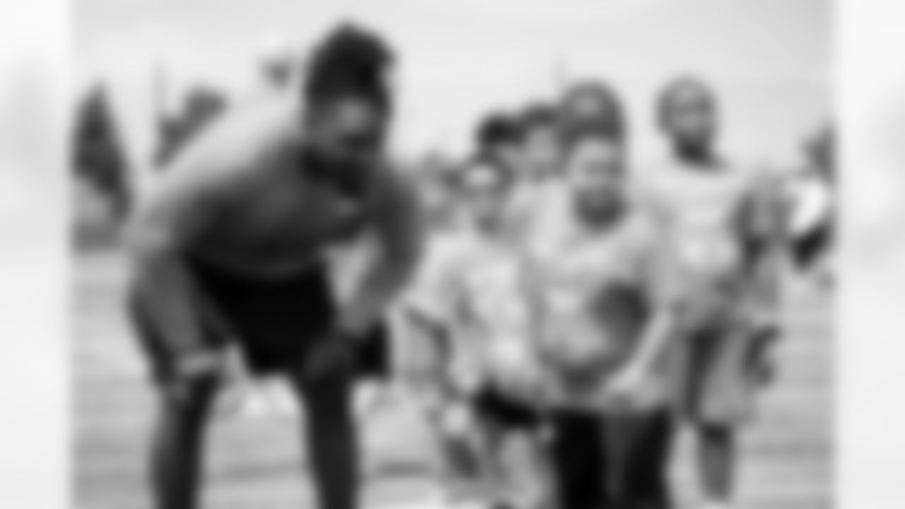Johnny Walker Jr. helps out as Nik Bonitto holds a youth football camp at Columbine High School on July 20, 2025 in Littleton, Colorado. Photo by Ben Swanson / Denver Broncos