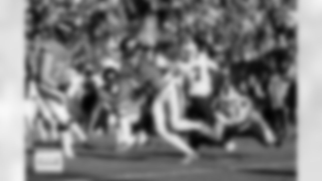 Denver Broncos quarterback Bo Nix (10) runs with the ball after a fumble recovery during the Broncos' Divisional Round playoff game against the Buffalo Bills at Empower Field at Mile High in Denver, Colorado on January 17, 2026. Photo by Gabriel Christus / Denver Broncos