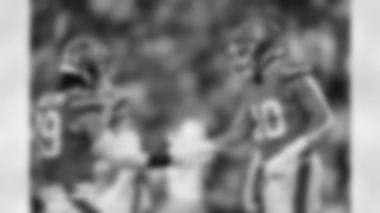 Alex Singleton (49) and Justin Strnad (40) during the Broncos' Week 18 game against the Los Angeles Chargers at Empower Field at Mile High in Denver, Colorado on January 4, 2026. Photo by Ben Swanson / Denver Broncos