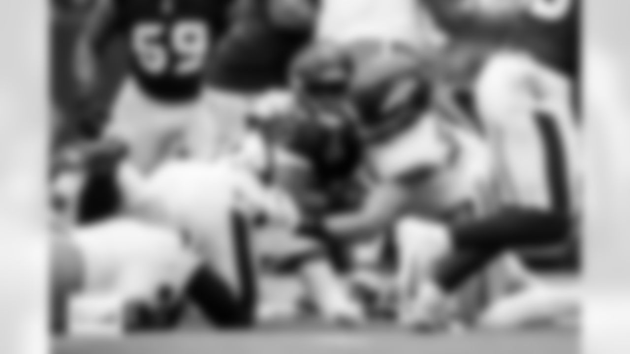 Denver Broncos defensive end Zach Allen (99) and linebacker Alex Singleton (49) tackle Houston Texans running back Woody Marks (27) during the Broncos' Week 9 game against the Houston Texans at NRG Stadium in Houston, Texas on November 2, 2025. Photo by Gabriel Christus / Denver Broncos