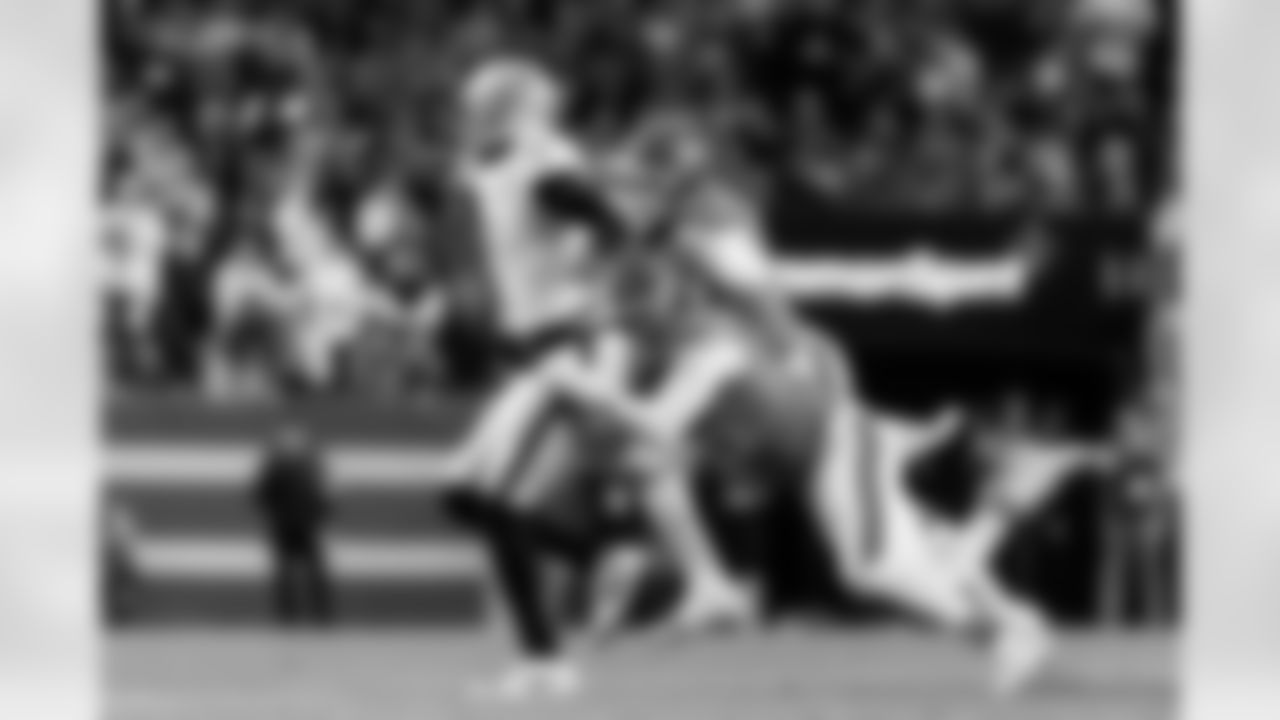 Denver Broncos linebackers Nik Bonitto (15) and Jonathon Cooper (0) chase down Raiders quarterback Geno Smith during the Broncos' Week 10 game against the Las Vegas Raiders at Empower Field at Mile High in Denver, Colorado on November 6, 2025. Photo by Gavin Liddell / Denver Broncos