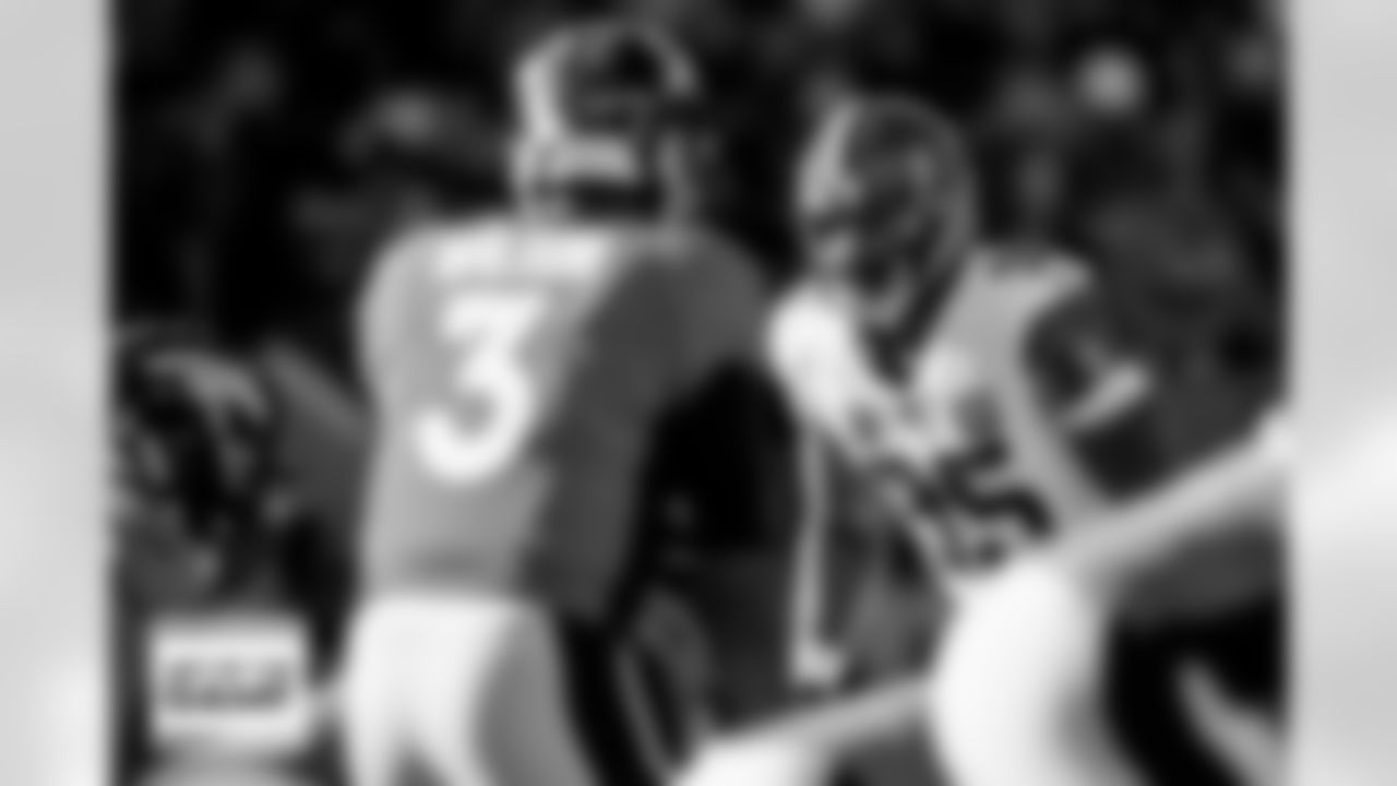 Cleveland Browns defensive end Myles Garrett (95) looks across at Denver Broncos quarterback Russell Wilson (3) during the Broncos' Week 12 game against the Cleveland Browns at Empower Field at Mile High in Denver, Colorado on November 26, 2023. Photo by Ben Swanson / Denver Broncos