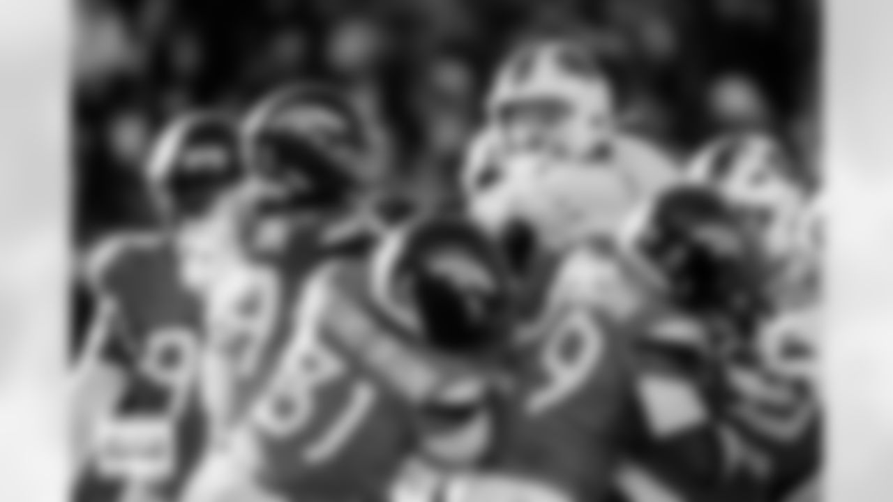 Denver Broncos linebacker Alex Singleton (49), cornerback Kris Abrams-Draine (31) and cornerback Ja'Quan McMillian (29) push Buffalo Bills quarterback Josh Allen (17) during the Broncos' Divisional Round playoff game against the Buffalo Bills at Empower Field at Mile High in Denver, Colorado on January 17, 2026. Photo by Ben Swanson / Denver Broncos