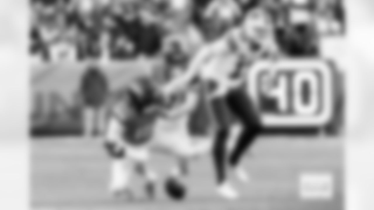 Denver Broncos linebacker Nik Bonitto (15) forces a fumble on Buffalo Bills quarterback Josh Allen (17) as safety Devon Key (26) looks to recover during the Broncos' Divisional Round playoff game against the Buffalo Bills at Empower Field at Mile High in Denver, Colorado on January 17, 2026. Photo by Adam Bratten / Denver Broncos