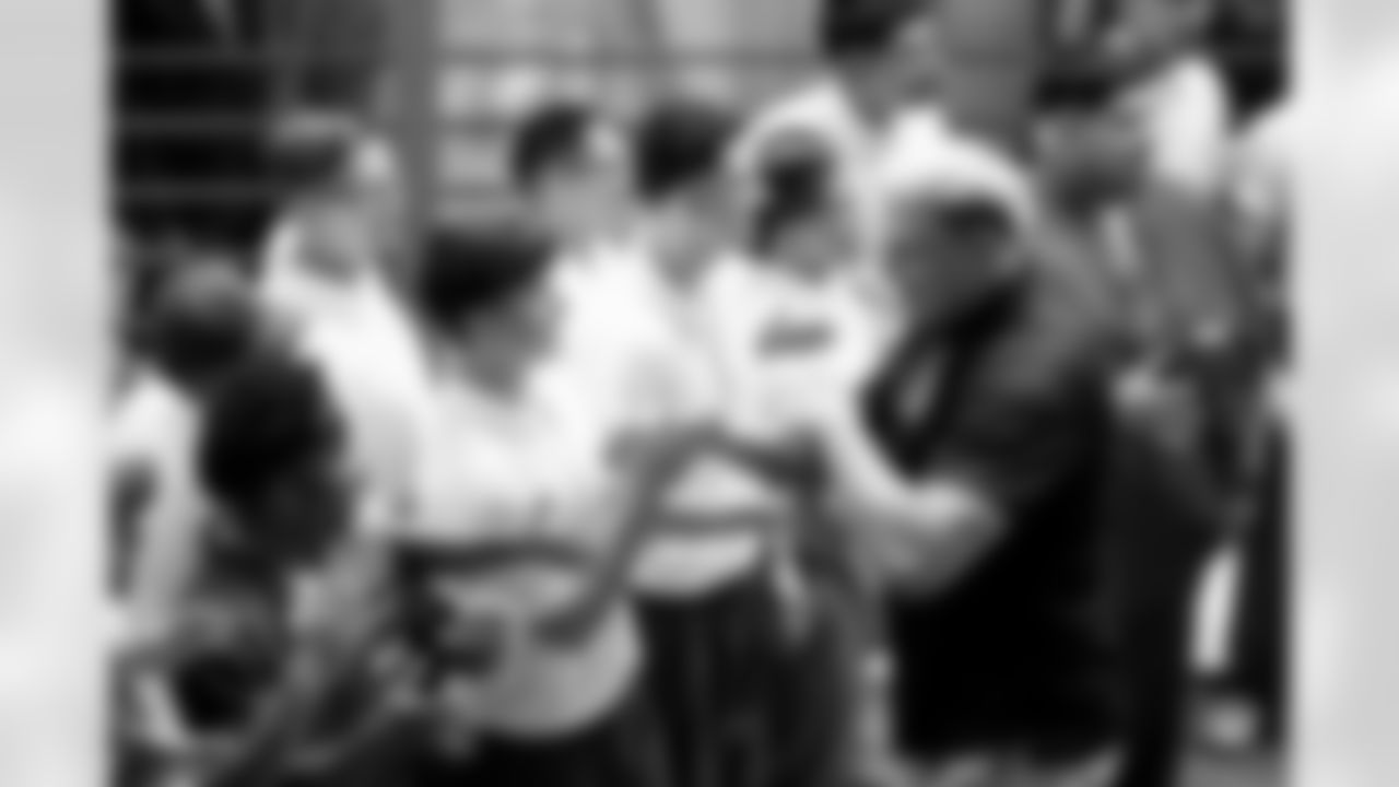 Garett Bolles greets ChangeMakers during a visit to the Arkansas Valley Correctional Facility in Ordway, Colorado on October 14, 2025. In partnership with the Vera Institute of Justice, the Denver Broncos Foundation toured ChangeMakers Village (a Restoring Promise Unit).Photo by Gabriel Christus / Denver Broncos