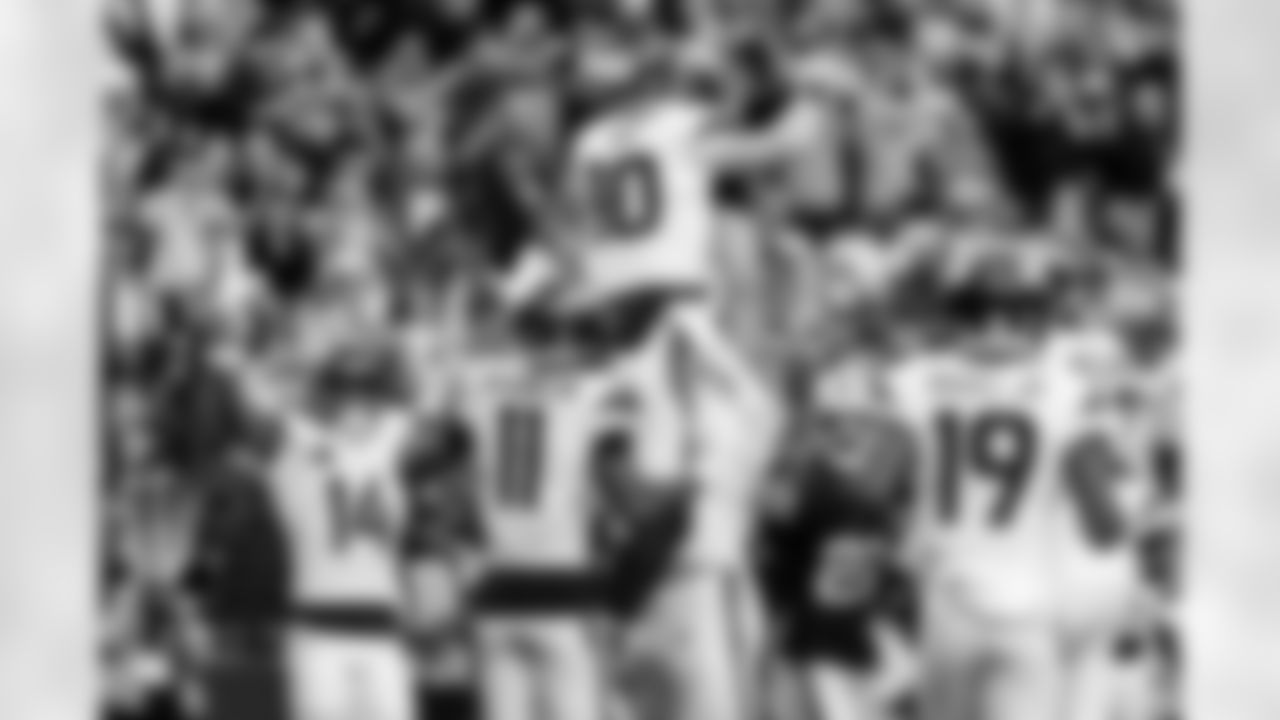 Denver Broncos quarterback Bo Nix (10) is lifted up by guard Quinn Meinerz (77) after a touchdown during the Broncos' Week 14 game against the Las Vegas Raiders at Allegiant Stadium in Las Vegas, Nevada on December 7, 2025. Photo by Ben Swanson / Denver Broncos