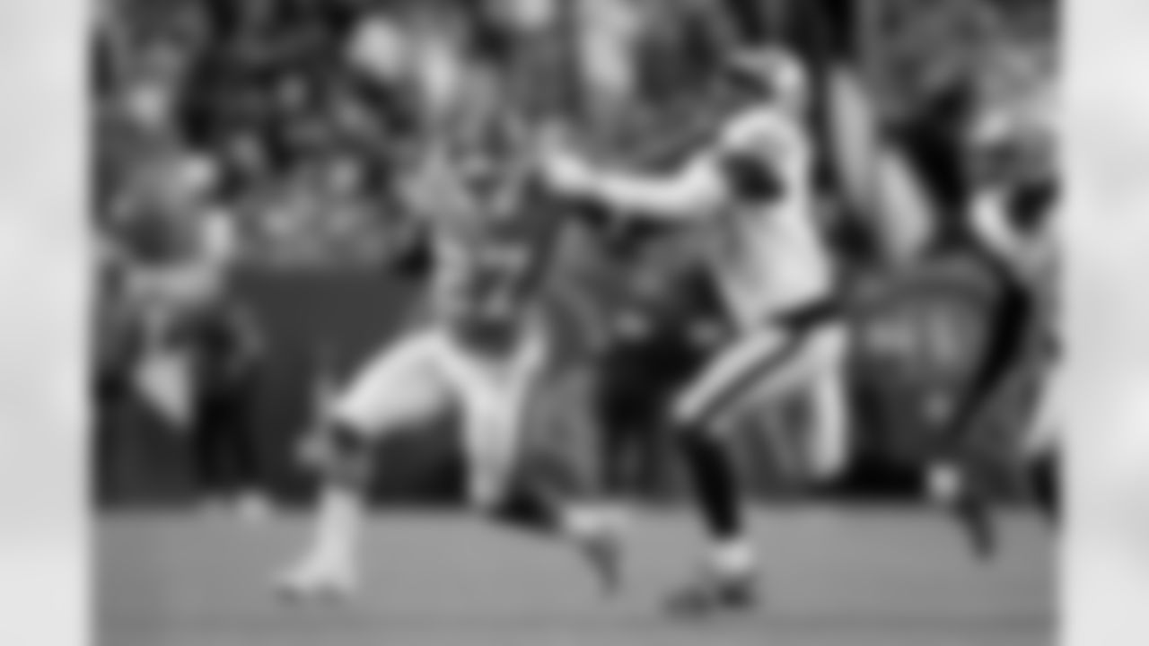 Denver Broncos running back J.K. Dobbins (27) runs with the ball and stiff-arms Las Vegas Raiders linebacker Devin White (45) during the Broncos' Week 10 game against the Las Vegas Raiders at Empower Field at Mile High in Denver, Colorado on November 6, 2025. Photo by Ben Swanson / Denver Broncos