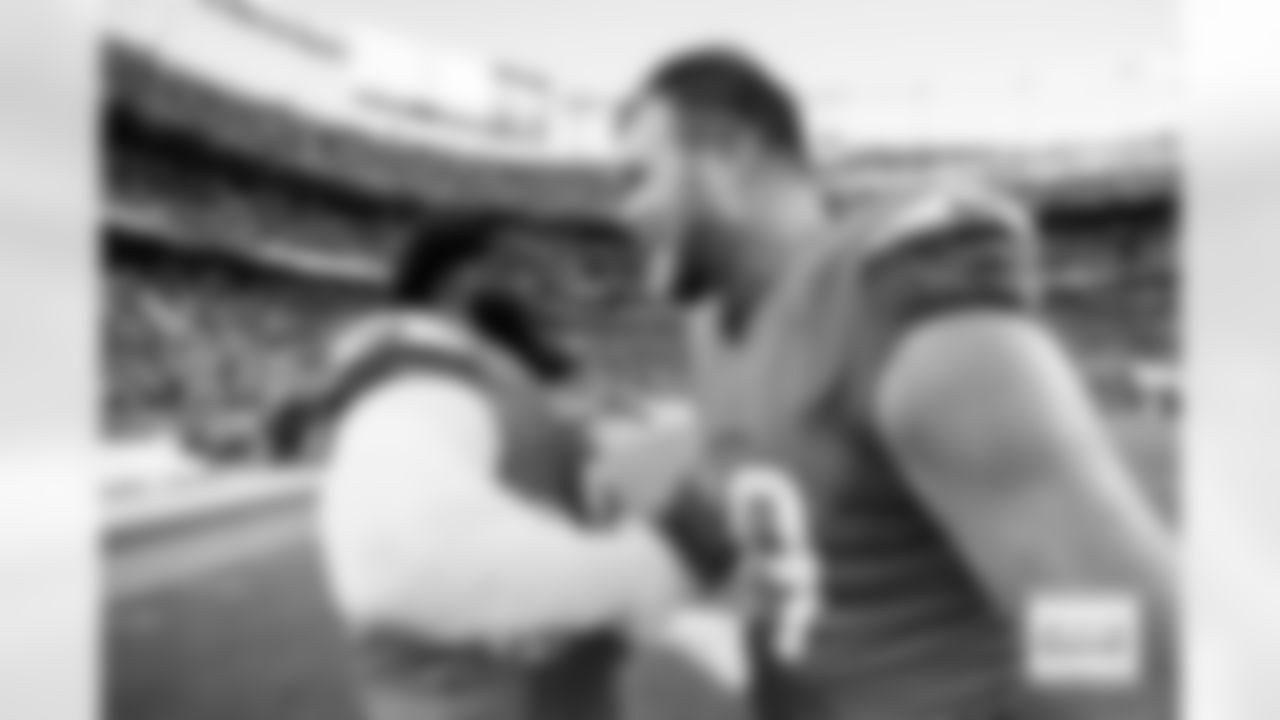 D.J. Jones and Mike McGlinchey after the Broncos' Week 7 game against the New York Giants at Empower Field at Mile High in Denver, Colorado on October 19, 2025. Photo by Ben Swanson / Denver Broncos