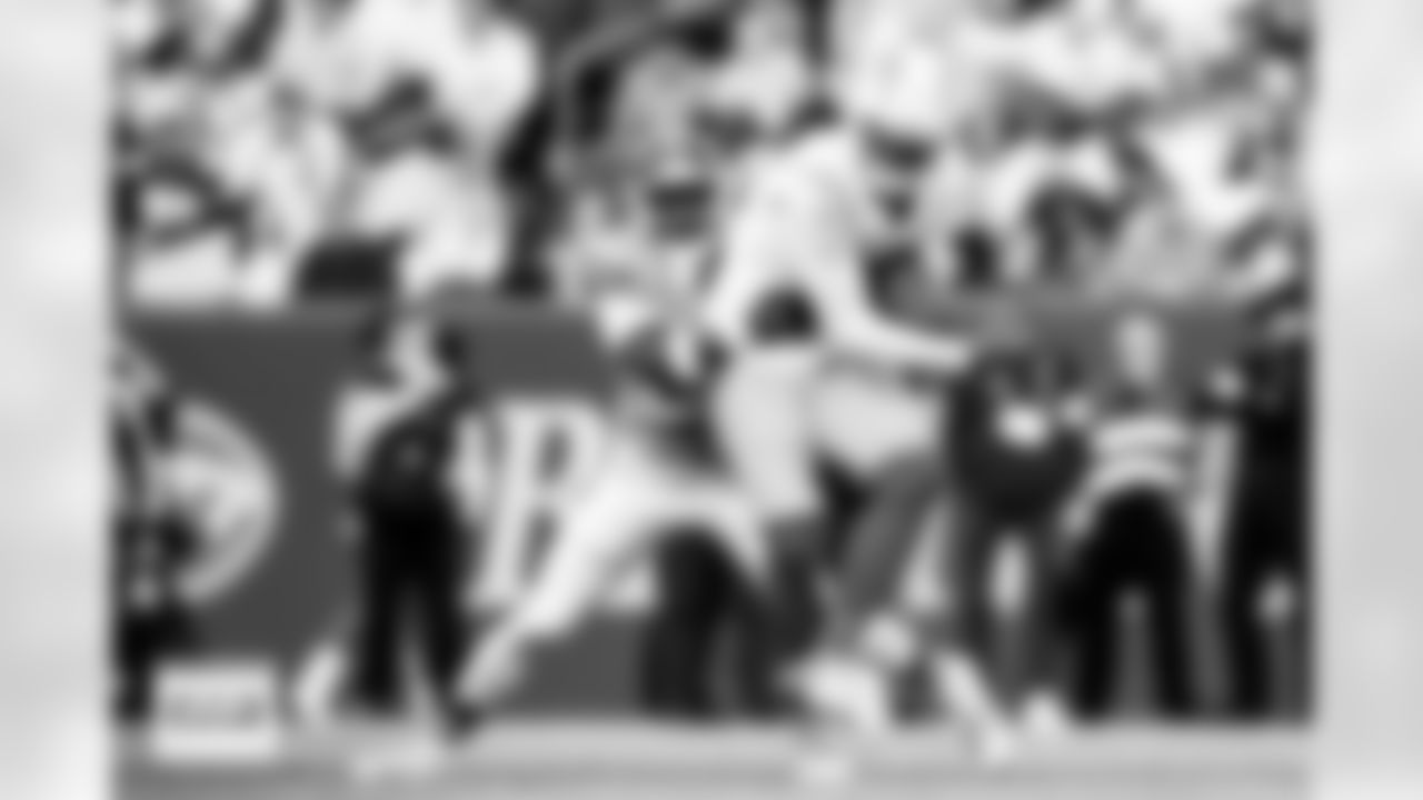 Ja'Quan McMillian tackles Keenan Allen during the Broncos' Week 18 game against the Los Angeles Chargers at Empower Field at Mile High in Denver, Colorado on January 4, 2026. Photo by Ben Swanson / Denver Broncos