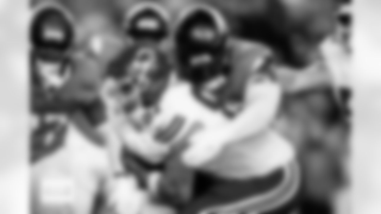 Denver Broncos defensive tackle D.J. Jones (93) tackles Kansas City Chiefs tight end Travis Kelce (87) during the Broncos' Week 11 game against the Kansas City Chiefs at Empower Field at Mile High in Denver, Colorado on November 16, 2025. Photo by Ben Swanson / Denver Broncos