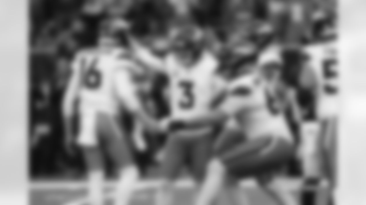 Wil Lutz celebrates with Jeremy Crawshaw, Mike McGlinchey and others during the Broncos' Week 9 game against the Houston Texans at NRG Stadium in Houston, Texas on November 2, 2025. Photo by Ben Swanson / Denver Broncos