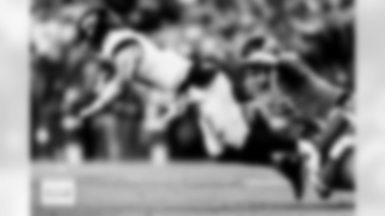 Denver Broncos defensive tackle Malcolm Roach (97) and defensive tackle D.J. Jones (93) bring down Jacksonville Jaguars quarterback Trevor Lawrence (16) during the Broncos' Week 16 game against the Jacksonville Jaguars at Empower Field at Mile High in Denver, Colorado on December 21, 2025. Photo by Ben Swanson / Denver Broncos