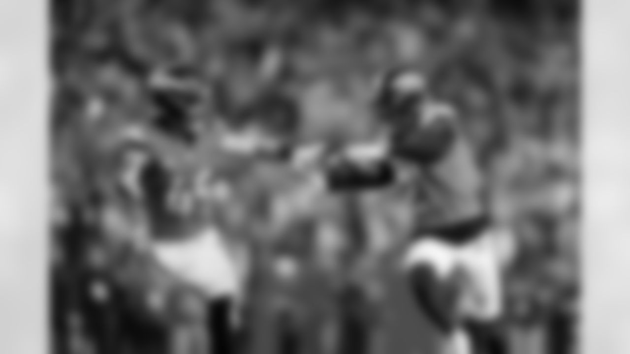 Denver Broncos cornerback Riley Moss (21) celebrates with linebacker Alex Singleton (49) after an interception during the Broncos' Week 15 game against the Green Bay Packers at Empower Field at Mile High in Denver, Colorado on December 14, 2025. Photo by Gabriel Christus / Denver Broncos