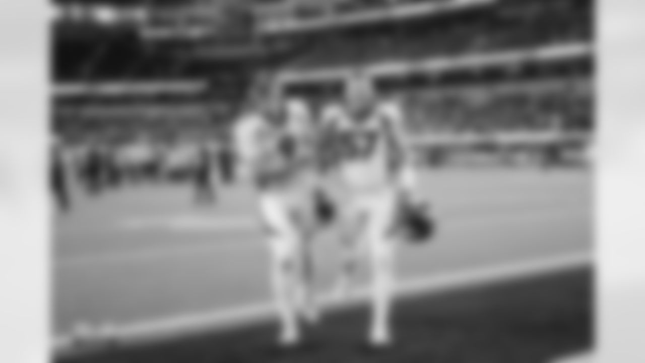 Riley Dixon and Ben Niemann celebrate after the Broncos' Week 14 game against the Los Angeles Chargers at SoFi Stadium in Inglewood, California on December 10, 2023. Photo by Ben Swanson / Denver Broncos