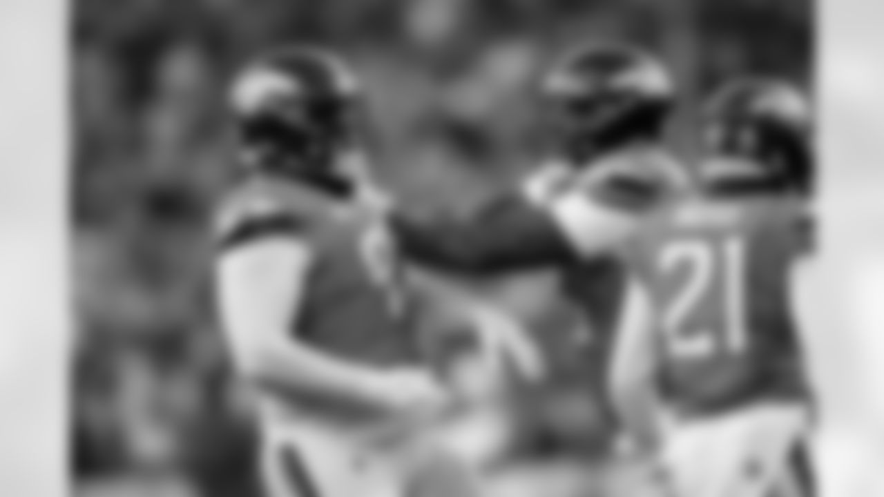 Denver Broncos defensive end Eyioma Uwazurike (96) celebrates with defensive tackle D.J. Jones (93) after a play during the Broncos' Week 7 game against the New York Giants at Empower Field at Mile High in Denver, Colorado on October 19, 2025. Photo by Ben Swanson / Denver Broncos