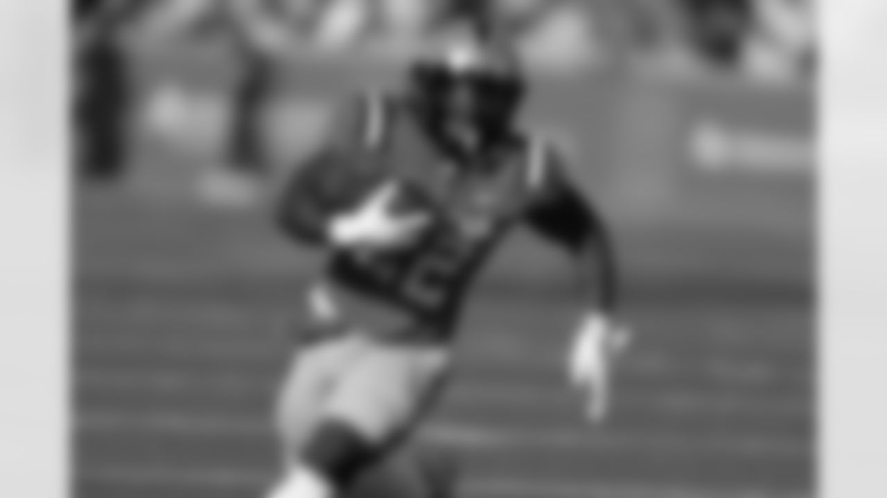 American team running back RJ Harvey (22), of UCF, carries the ball during the second half of the Senior Bowl NCAA college football game, Saturday, Feb. 1, 2025, in Mobile, Ala. (AP Photo/Butch Dill)