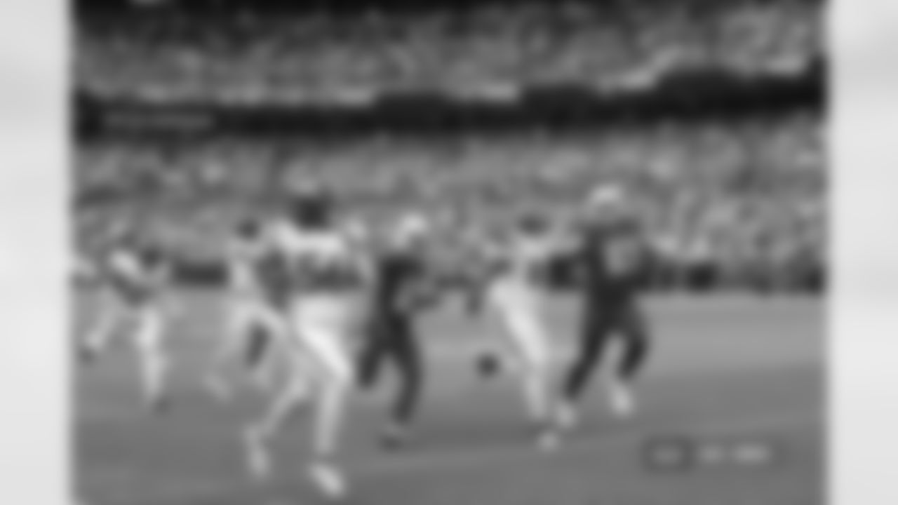 Levelle Bailey #56 of the Denver Broncos runs for a touchdown after an interception during the Broncos' Preseason Week 3 game against the Arizona Cardinals at Empower Field At Mile High on August 25, 2024 in Denver, Colorado. (Photo by Gabriel Christus/Denver Broncos)