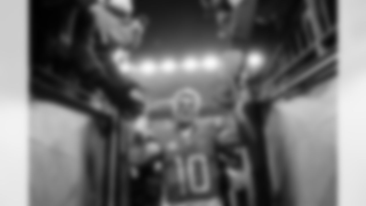 Denver Broncos quarterback Bo Nix (10) high-fives fans as he walks off the field after the Broncos' Divisional Round playoff game against the Buffalo Bills at Empower Field at Mile High in Denver, Colorado on January 17, 2026. Photo by Ben Swanson / Denver Broncos