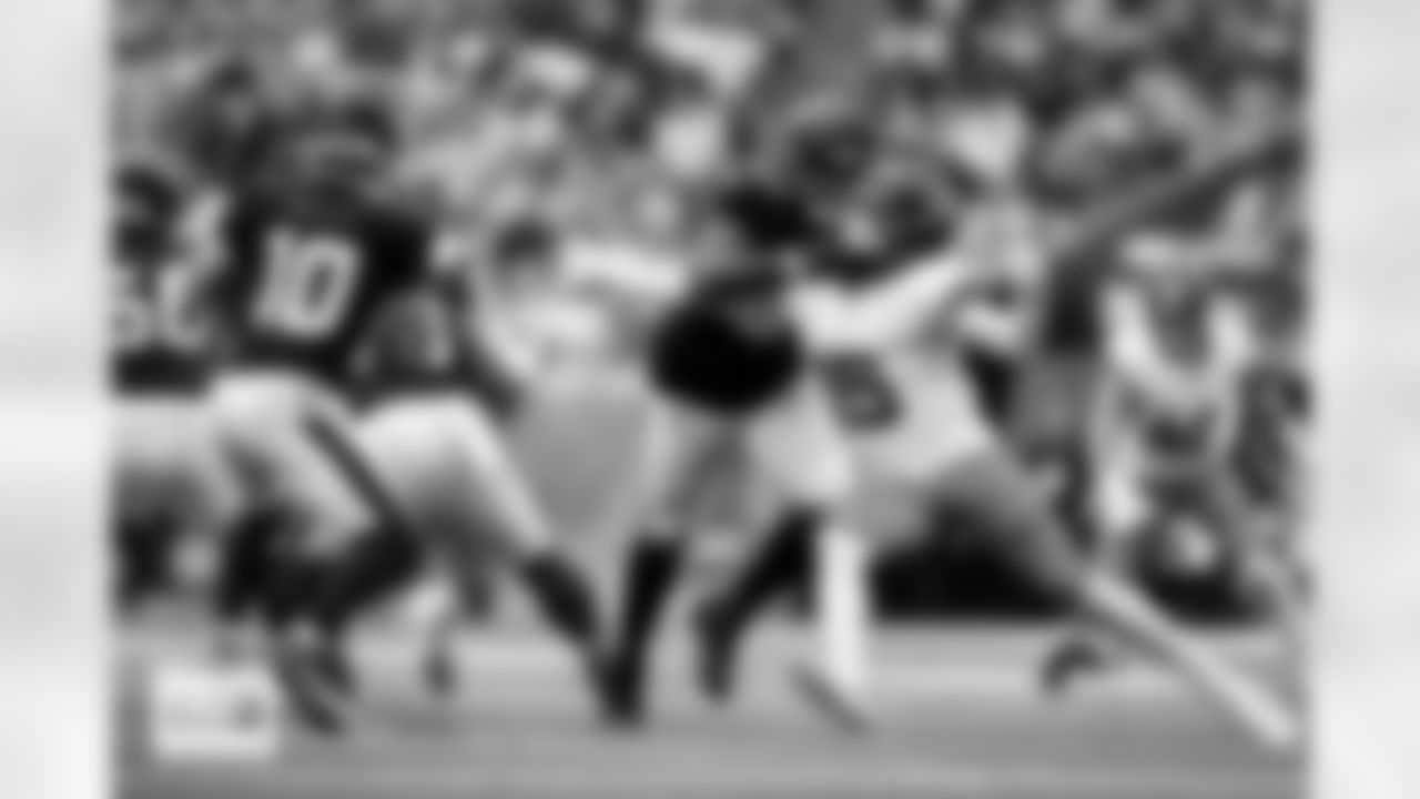 Denver Broncos linebacker Nik Bonitto (15) works against Houston Texans offensive tackle Blake Fisher (57) to pressure quarterback Davis Mills (10) during the Broncos' Week 9 game against the Houston Texans at NRG Stadium in Houston, Texas on November 2, 2025. Photo by Ben Swanson / Denver Broncos