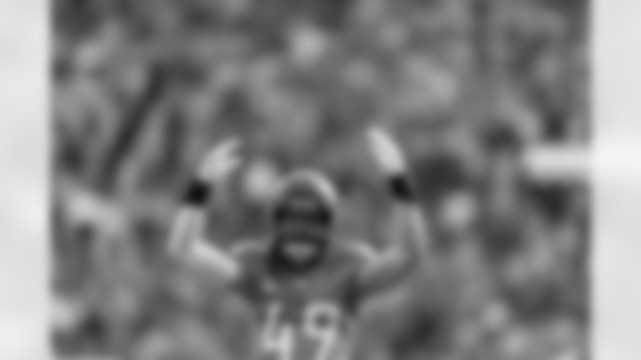 Denver Broncos linebacker Alex Singleton (49) raises his hands to get the crowd hyped during the AFC Championship Game between the Denver Broncos and New England Patriots at Empower Field at Mile High in Denver, Colorado on January 25, 2026. Photo by Gabriel Christus / Denver Broncos