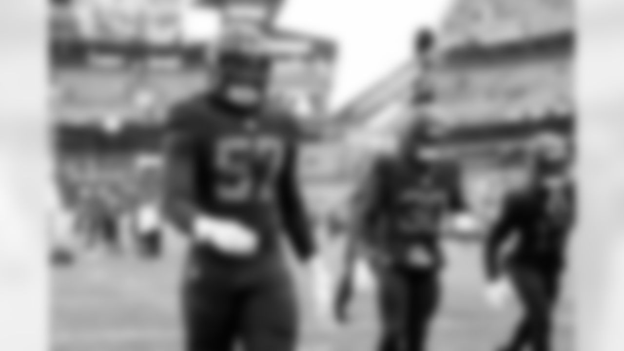 Defensive end Isaiah McGuire (57)