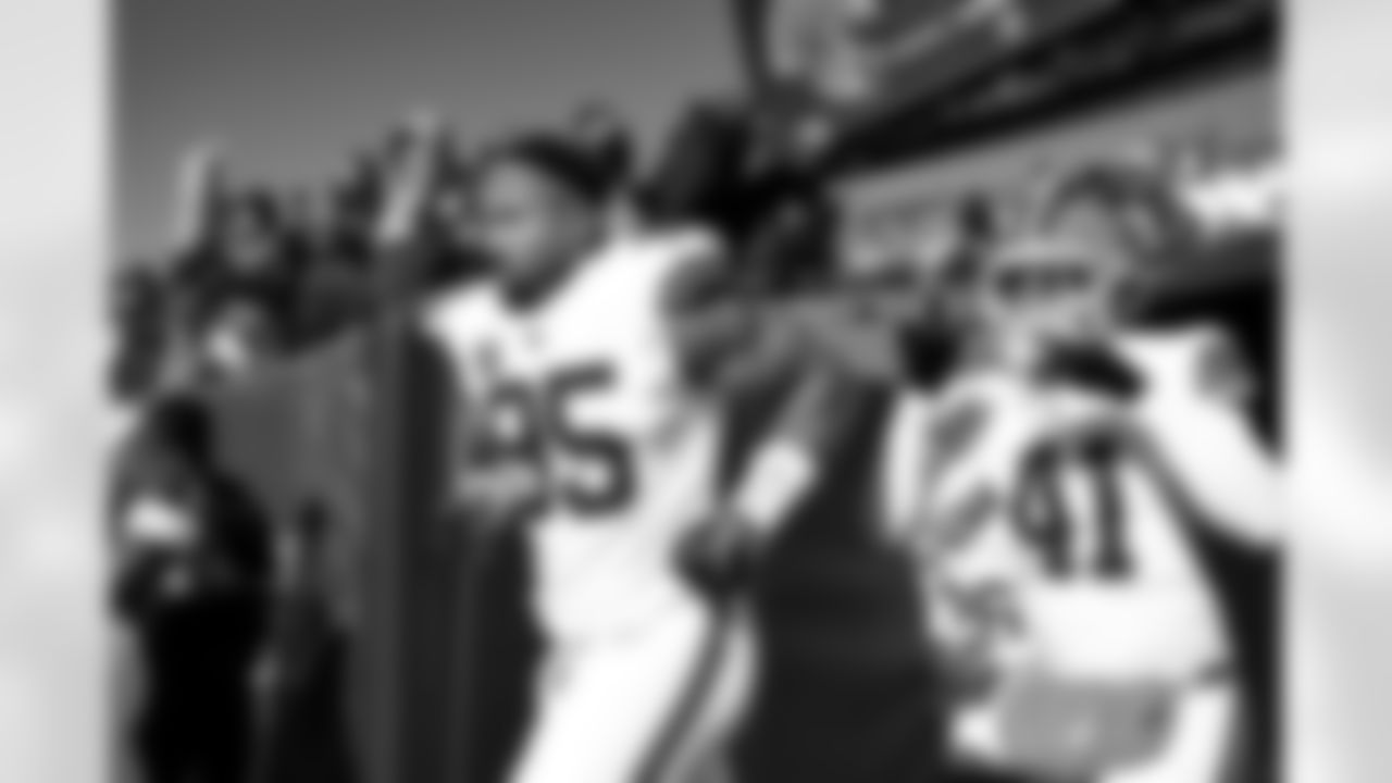 Defensive end Myles Garrett (95) and Safety Christopher Edmonds (41) before a NFL football game between the Cleveland Browns and Chicago Bears on December 14, 2025 at Soldier Field.