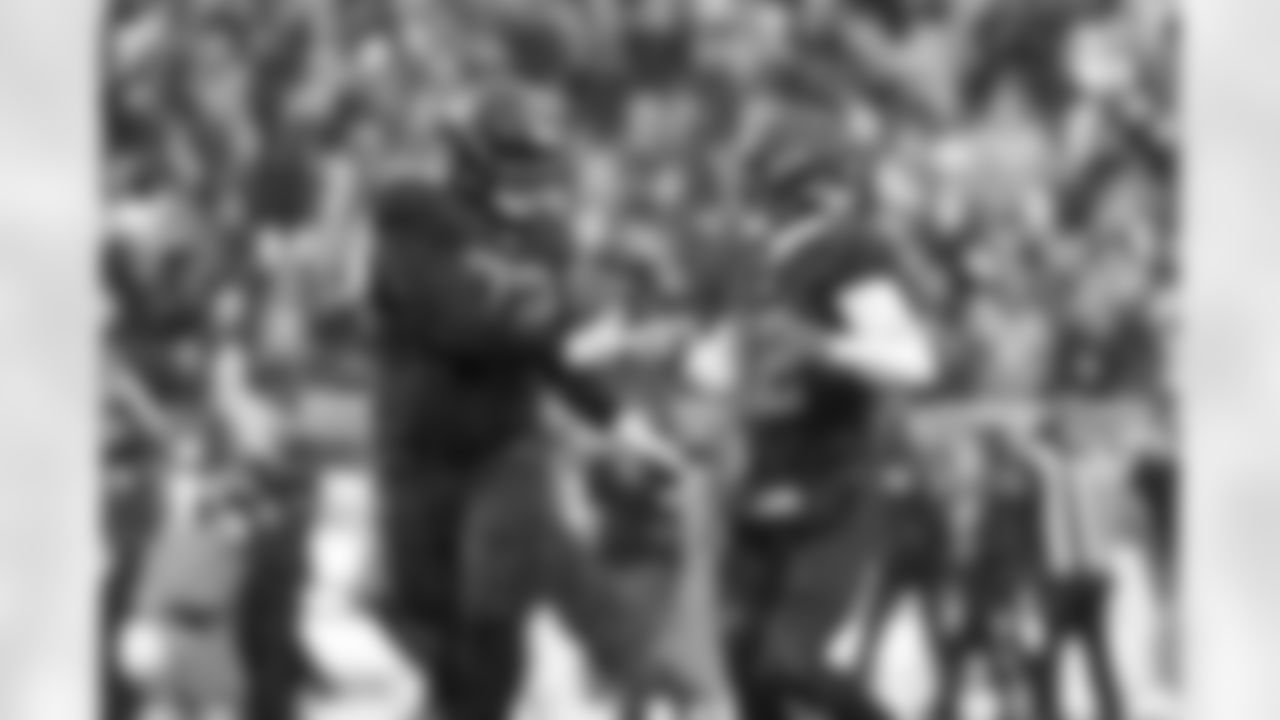 Offensive tackle KT Leveston (72) and Quarterback Shedeur Sanders (12) during a NFL football game between the Tennessee Titans and Cleveland Browns on December 7, 2025 at Huntington Bank Field.