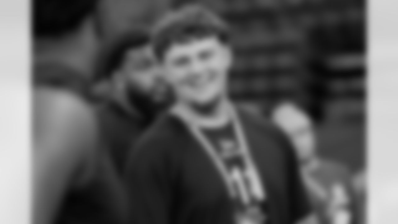 Michigan defensive lineman Mason Graham chats with others as he waits to run a drill at the NFL football scouting combine in Indianapolis, Thursday, Feb. 27, 2025. (AP Photo/George Walker IV)