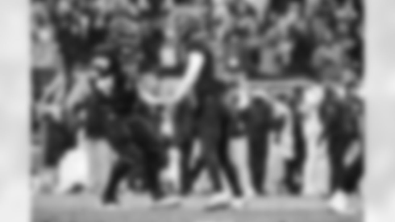 Offensive guard Joel Bitonio (75) and Quarterback Shedeur Sanders (12) during a NFL football game between the Tennessee Titans and Cleveland Browns on December 7, 2025 at Huntington Bank Field.