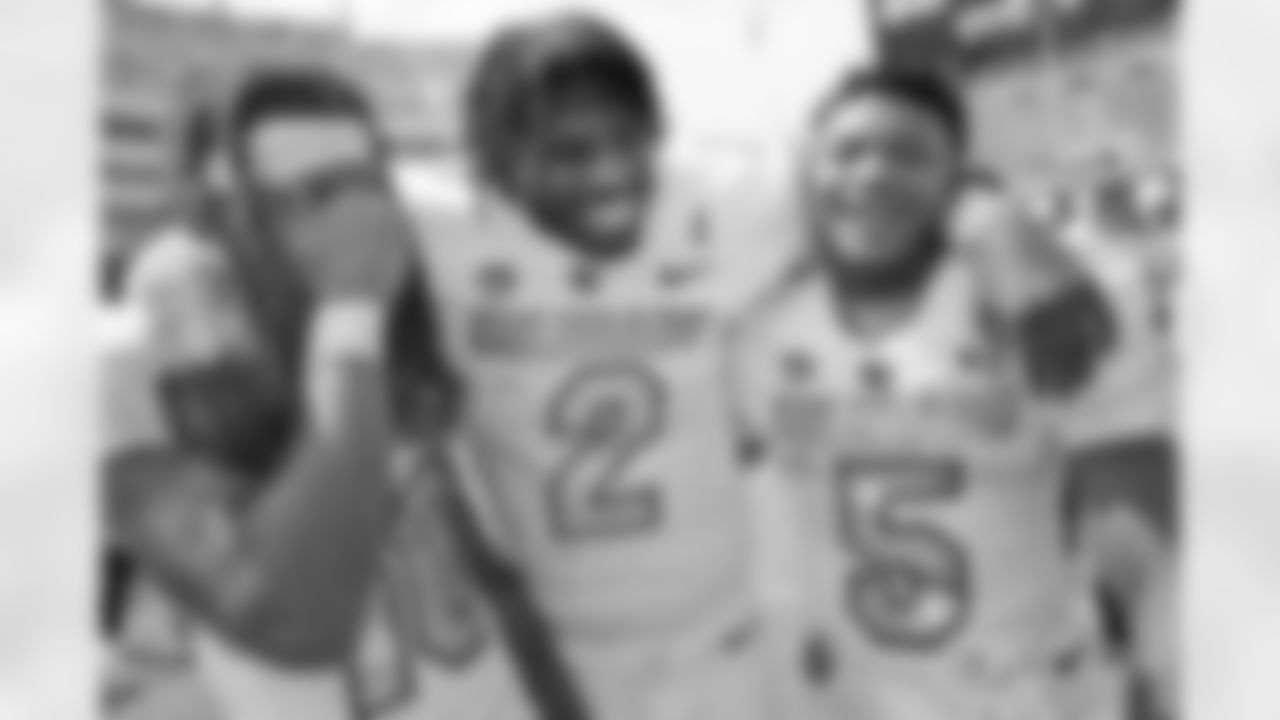 Colorado quarterback Shedeur Sanders (2) embraces wide receivers Xavier Weaver (10) and Jimmy Horn Jr. (5) after an NCAA college football game Saturday, Sept. 2, 2023, in Fort Worth, Texas. (AP Photo/LM Otero)
