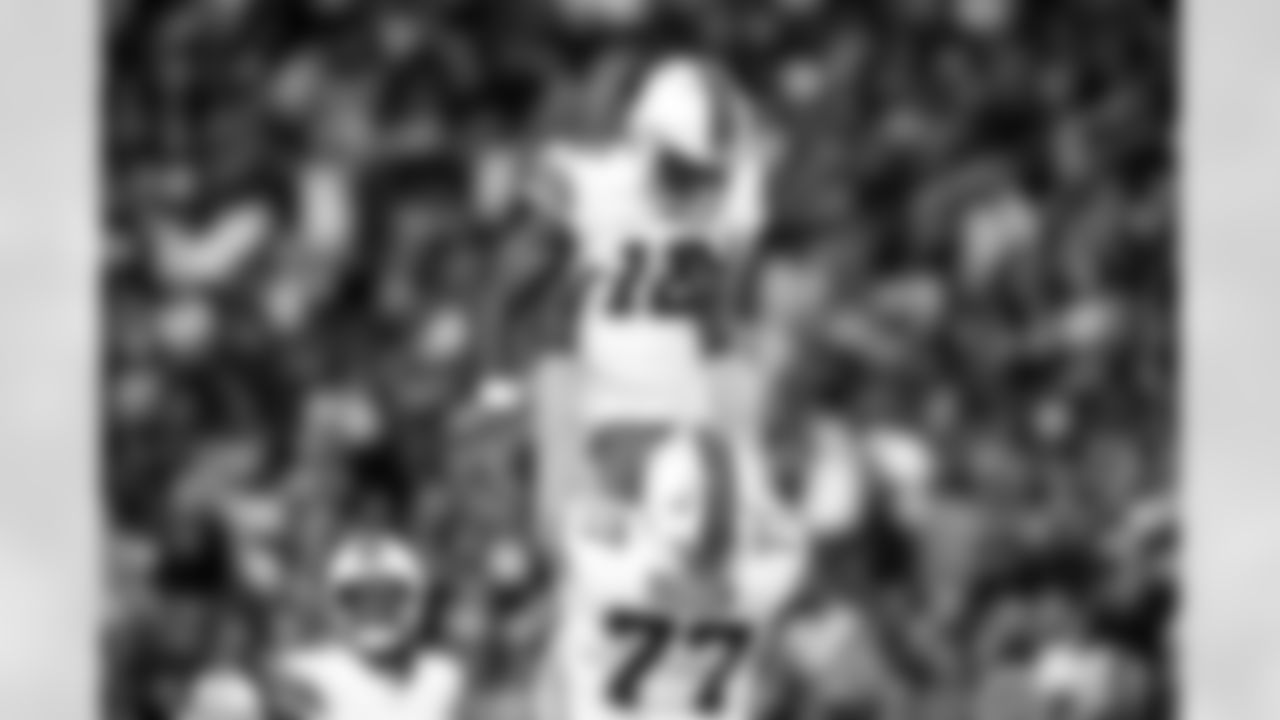 Quarterback Shedeur Sanders (12) and Offensive guard Wyatt Teller (77) during a NFL football game between the Cleveland Browns and Las Vegas Raiders on November 23, 2025 at Allegiant Stadium.