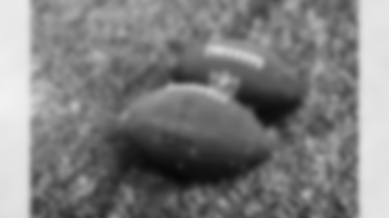 Footballs during practice at CrossCountry Mortgage Campus on November 28, 2025.